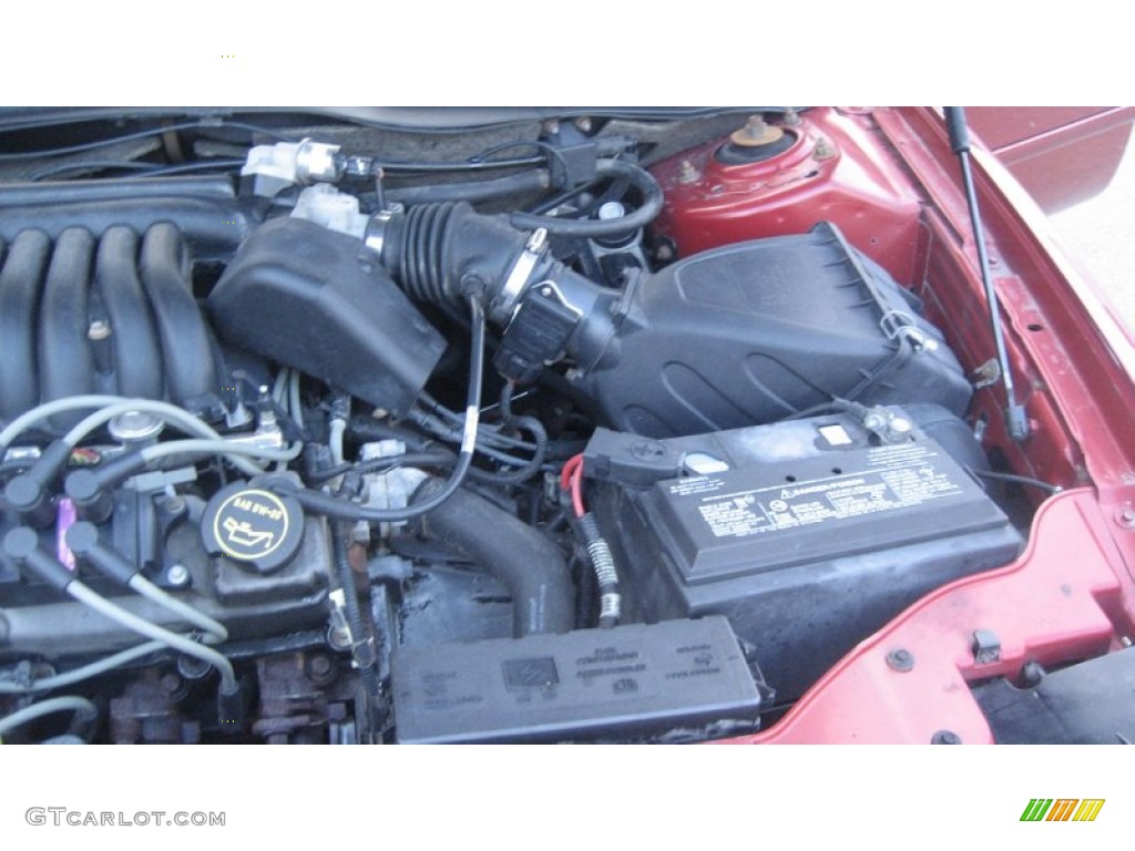 2002 Taurus SE - Matador Red Metallic / Medium Graphite photo #19