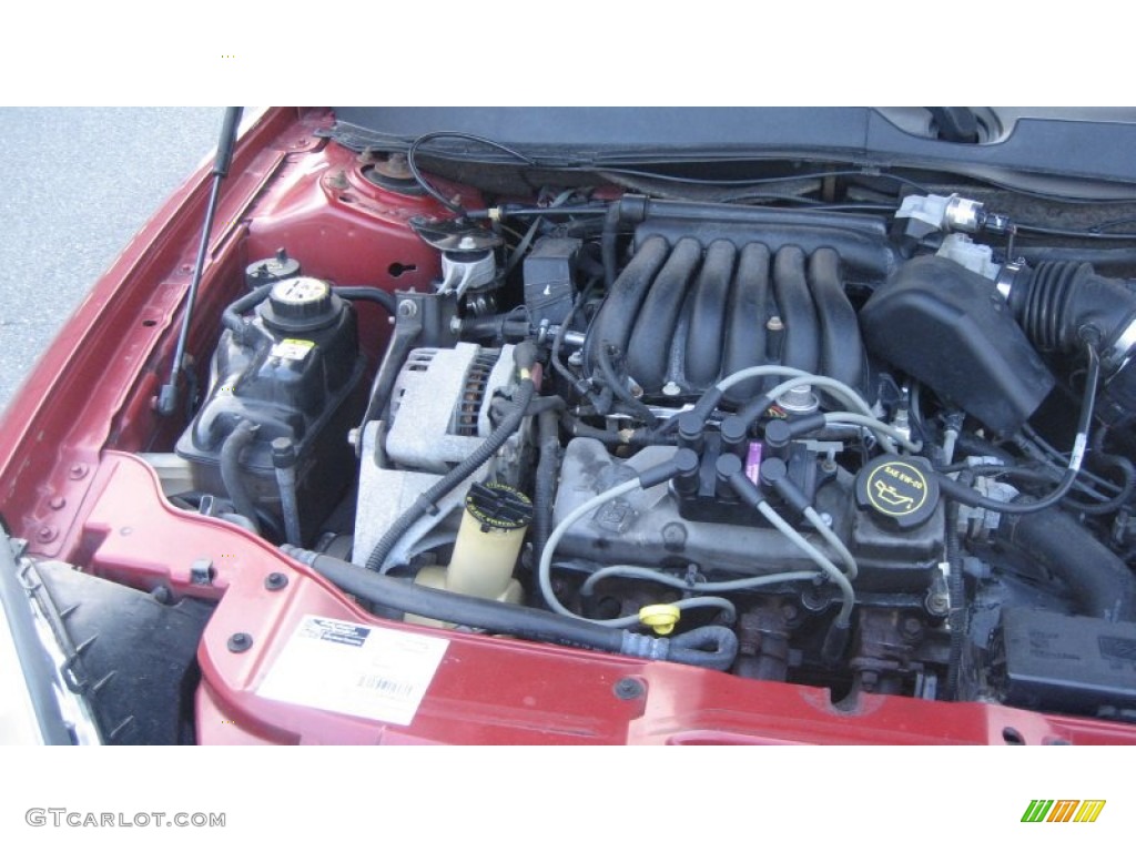 2002 Taurus SE - Matador Red Metallic / Medium Graphite photo #20