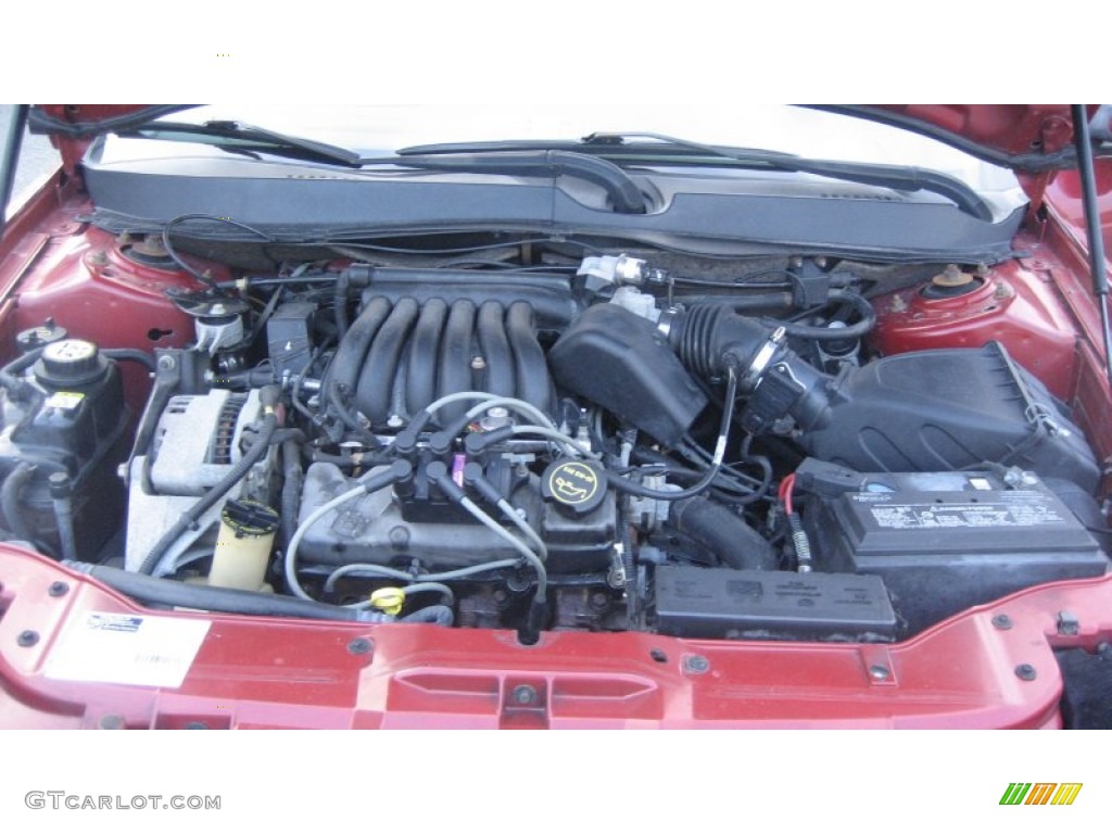 2002 Taurus SE - Matador Red Metallic / Medium Graphite photo #21