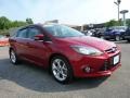 2013 Ruby Red Ford Focus Titanium Sedan  photo #1