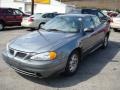 2004 Greystone Metallic Pontiac Grand Am SE Sedan  photo #4