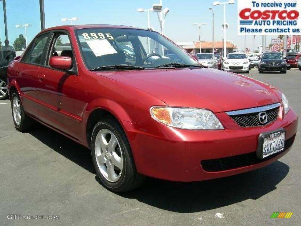 Garnet Red Metallic Mazda Protege