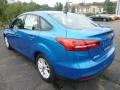 2015 Blue Candy Metallic Ford Focus SE Sedan  photo #4