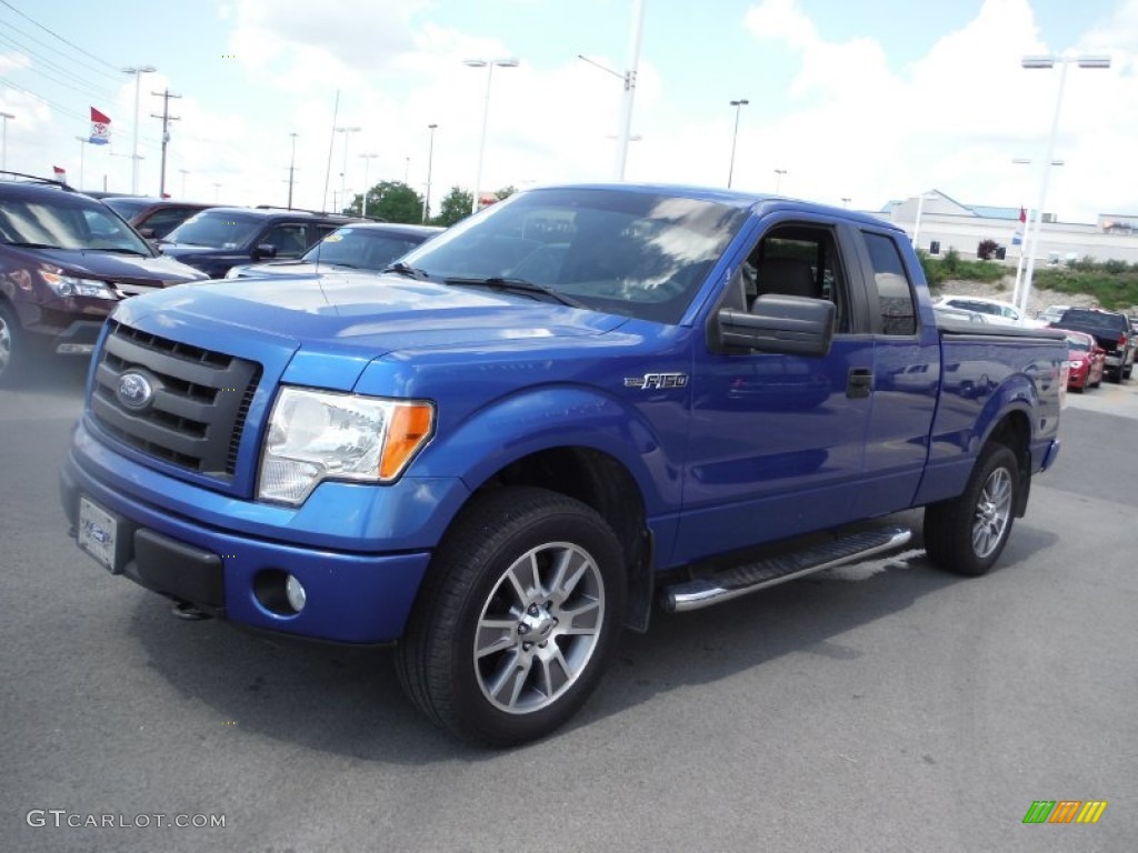 Blue Flame Metallic 2010 Ford F150 STX SuperCab 4x4 Exterior Photo #105731189