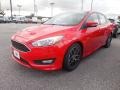 2015 Race Red Ford Focus SE Sedan  photo #1