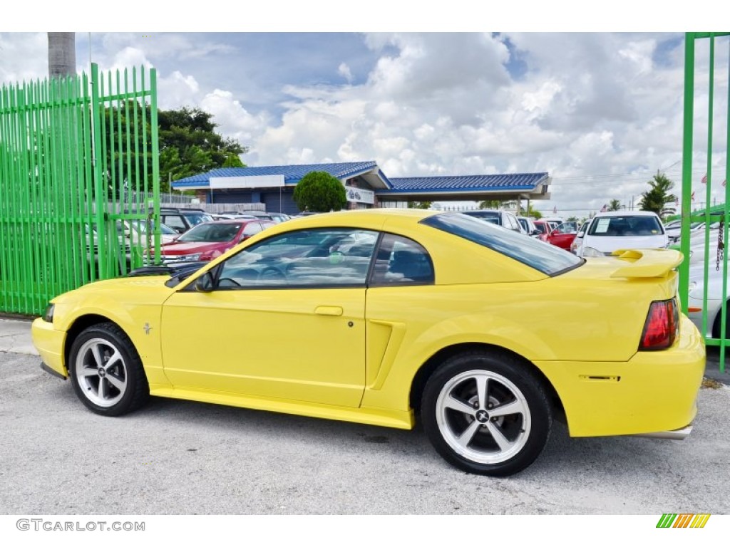 2002 Mustang V6 Coupe - Zinc Yellow / Medium Graphite photo #45