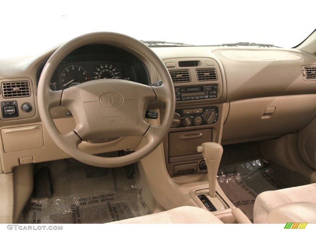 2002 Toyota Corolla LE Pebble Beige Dashboard Photo #107745143
