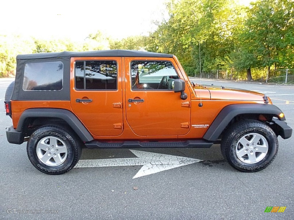 Mango Tango Pearl 2010 Jeep Wrangler Unlimited Mountain Edition 4x4 Exterior Photo #107844384