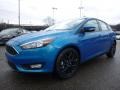 2016 Blue Candy Ford Focus SE Hatch  photo #7