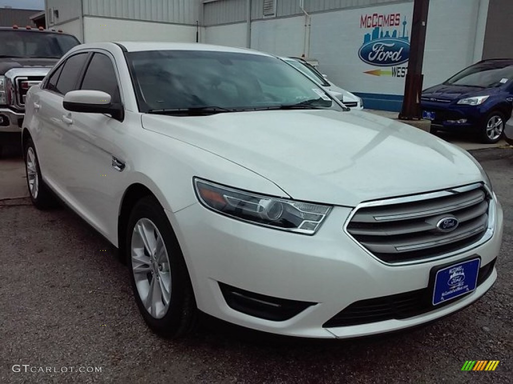 White Platinum Metallic Ford Taurus