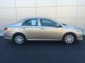 2010 Desert Sand Metallic Toyota Corolla LE  photo #2