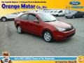 2010 Sangria Red Metallic Ford Focus SE Coupe  photo #1