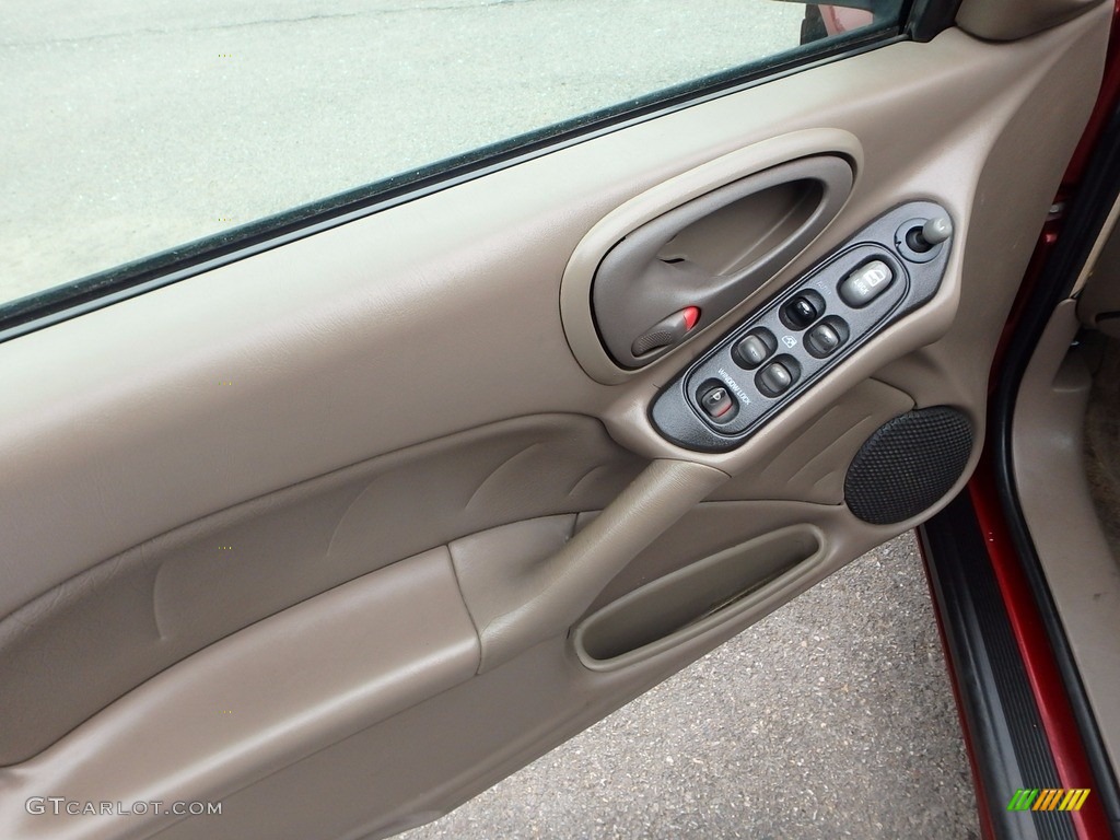 2002 Grand Am SE Sedan - Redfire Metallic / Dark Taupe photo #11