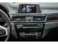 2016 BMW X1 Black Interior Controls Photo
