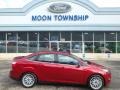 2014 Ruby Red Ford Focus Titanium Sedan  photo #1