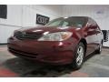 2004 Salsa Red Pearl Toyota Camry LE  photo #3