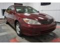 2004 Salsa Red Pearl Toyota Camry LE  photo #5