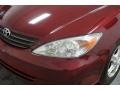 2004 Salsa Red Pearl Toyota Camry LE  photo #48