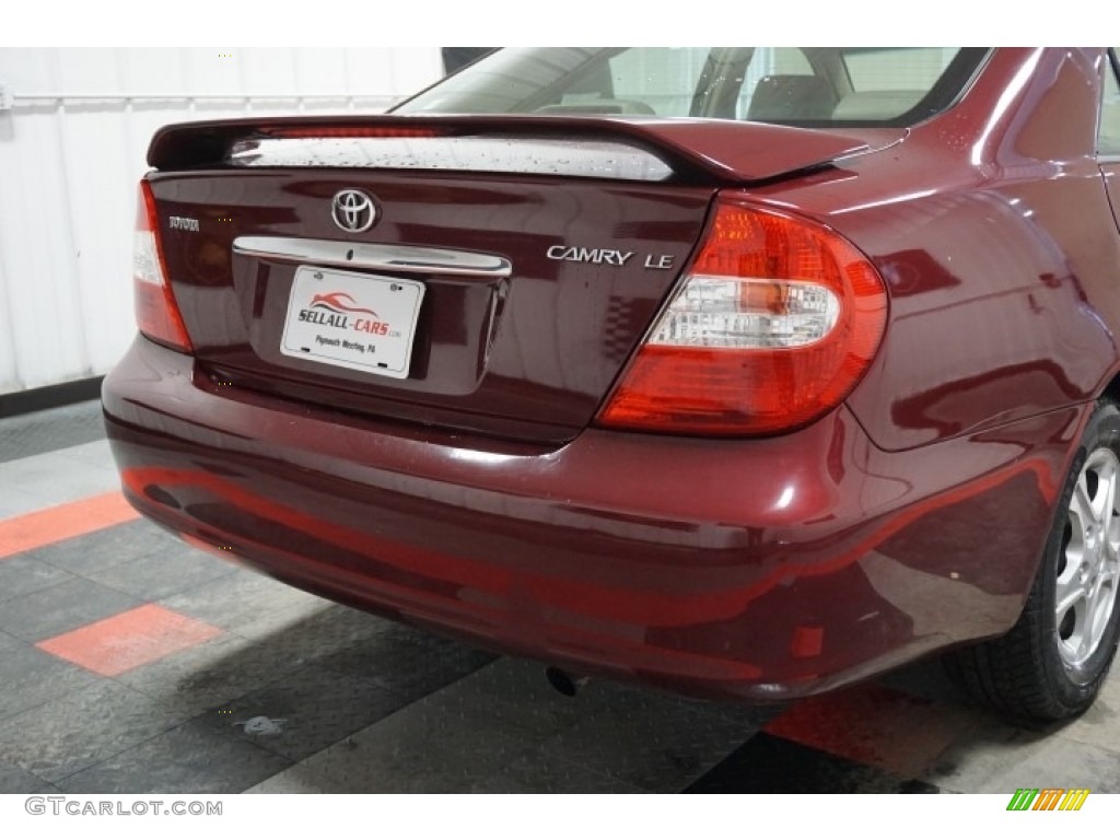 2004 Camry LE - Salsa Red Pearl / Stone photo #69