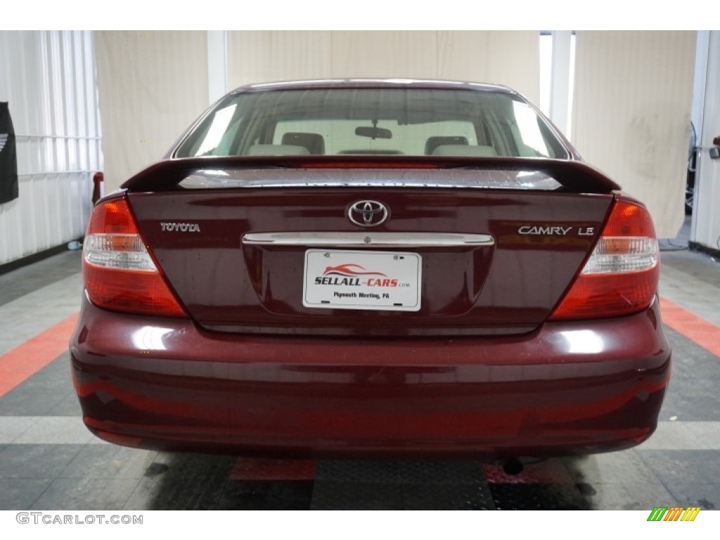 2004 Camry LE - Salsa Red Pearl / Stone photo #70