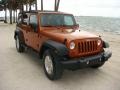 2010 Mango Tango Pearl Jeep Wrangler Unlimited Sport #113121947