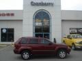 2007 Red Rock Crystal Pearl Jeep Grand Cherokee Laredo 4x4  photo #1