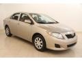 2010 Desert Sand Metallic Toyota Corolla LE  photo #1