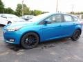 2016 Blue Candy Ford Focus SE Hatch  photo #5