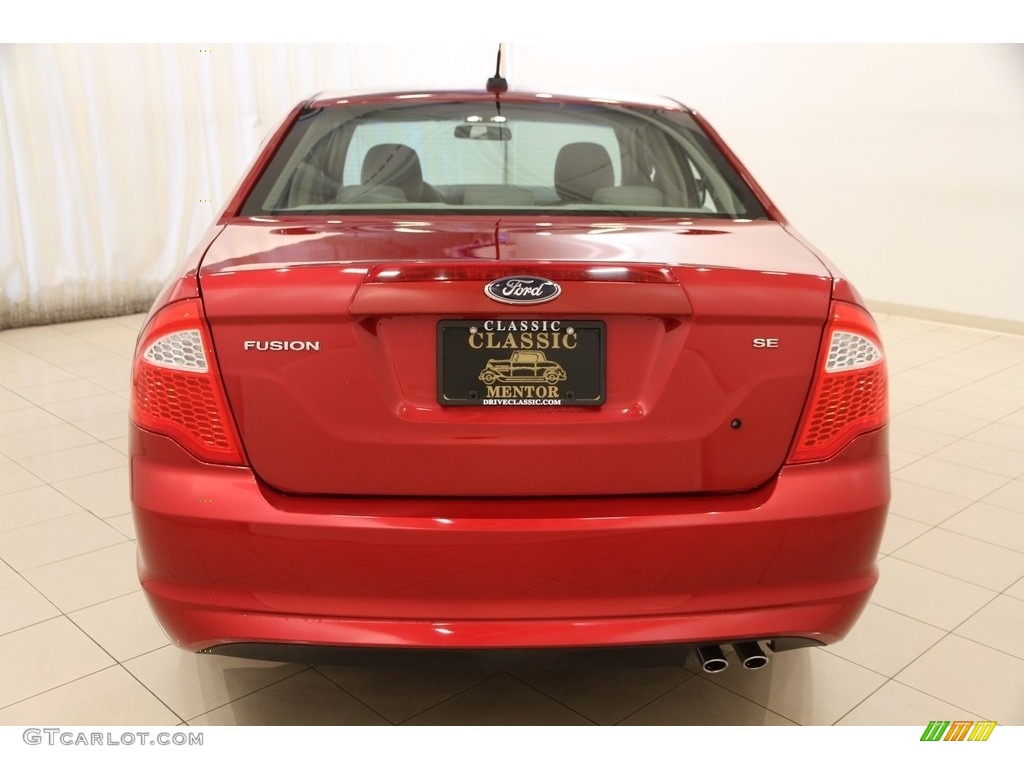 2010 Fusion SE - Red Candy Metallic / Medium Light Stone photo #17