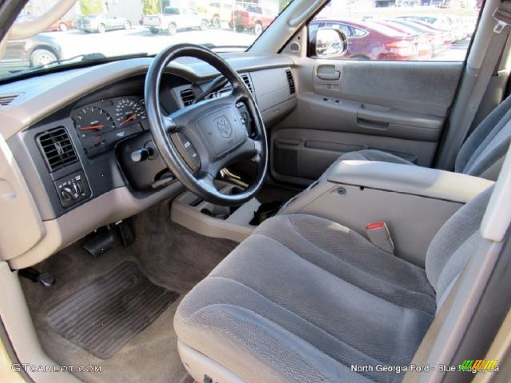 2004 Dakota SLT Quad Cab 4x4 - Light Almond Pearl Metallic / Taupe photo #25