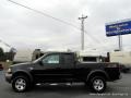 2002 Black Ford F150 XLT SuperCab 4x4  photo #2