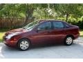 2006 Dark Toreador Red Metallic Ford Focus ZX4 SE Sedan  photo #3