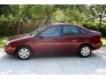 2006 Dark Toreador Red Metallic Ford Focus ZX4 SE Sedan  photo #4