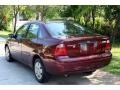 2006 Dark Toreador Red Metallic Ford Focus ZX4 SE Sedan  photo #9