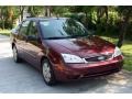 2006 Dark Toreador Red Metallic Ford Focus ZX4 SE Sedan  photo #19