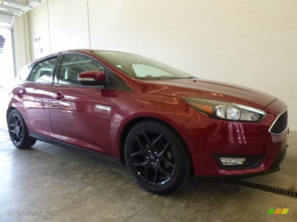 2016 Focus SE Hatch - Ruby Red / Charcoal Black photo #1