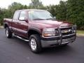 2001 Dark Carmine Red Metallic Chevrolet Silverado 2500HD LS Extended Cab 4x4  photo #21