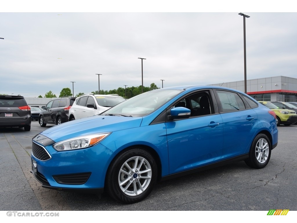 Blue Candy 2016 Ford Focus SE Sedan Exterior Photo #120147101