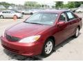 2004 Salsa Red Pearl Toyota Camry LE  photo #1