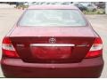 2004 Salsa Red Pearl Toyota Camry LE  photo #6