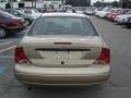 Fort Knox Gold - Focus LX Sedan Photo No. 3