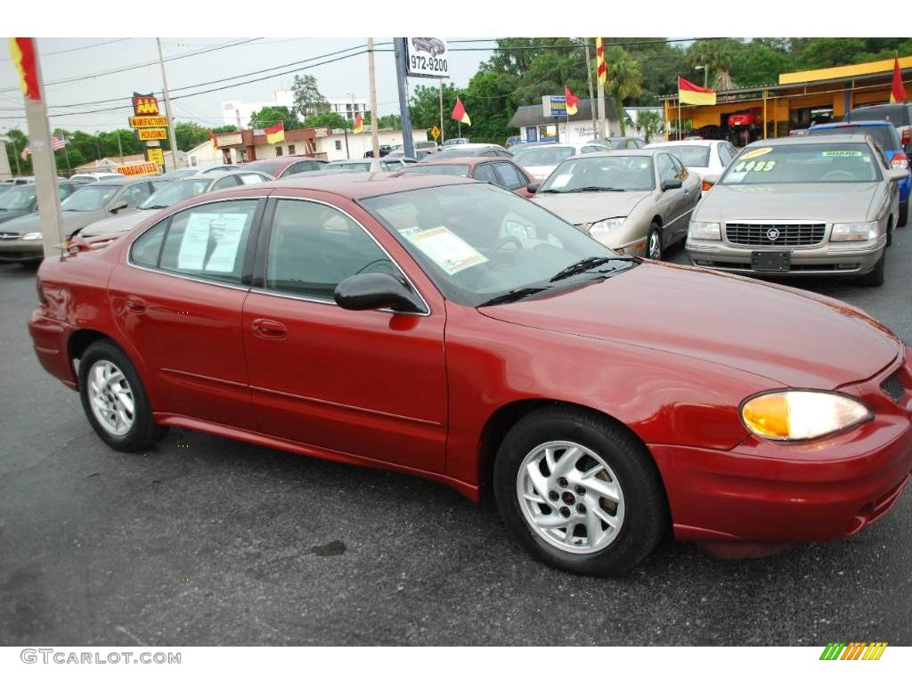 2004 Grand Am SE Sedan - Sport Red Metallic / Dark Pewter photo #1