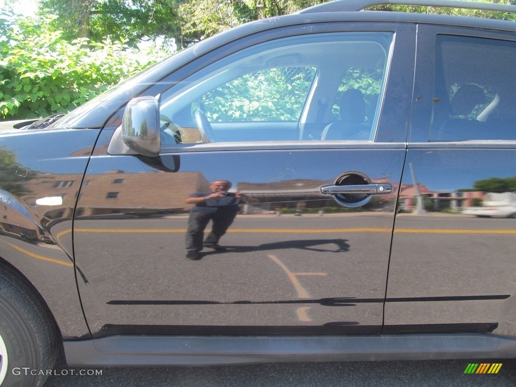 2010 Outlander ES 4WD - Labrador Black Pearl / Black photo #11