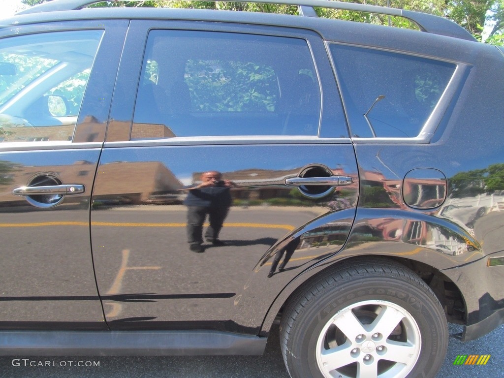 2010 Outlander ES 4WD - Labrador Black Pearl / Black photo #13