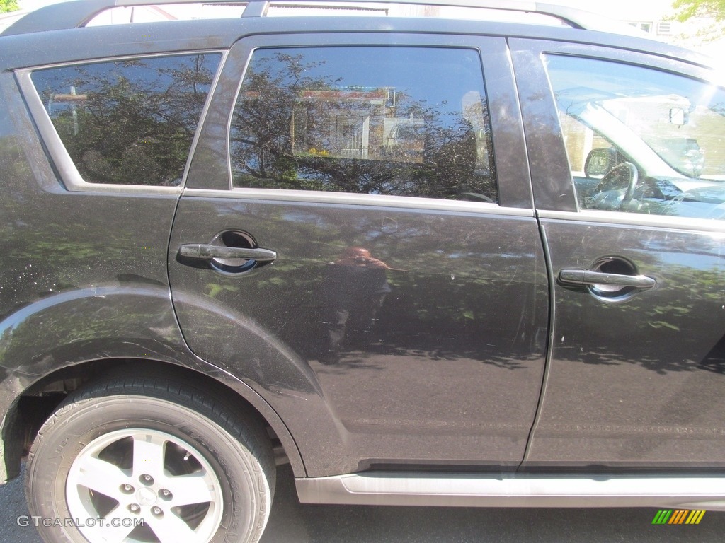 2010 Outlander ES 4WD - Labrador Black Pearl / Black photo #14