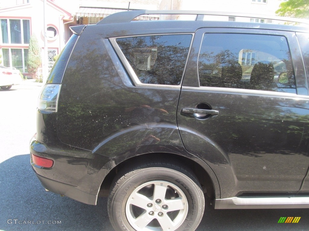 2010 Outlander ES 4WD - Labrador Black Pearl / Black photo #16