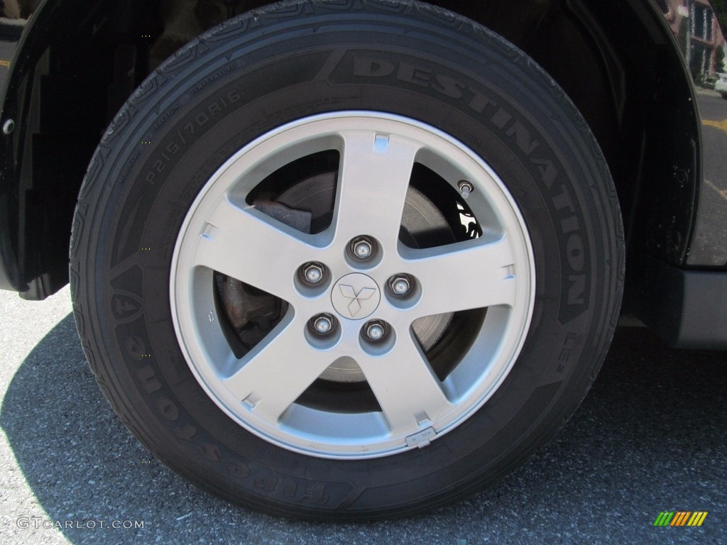 2010 Outlander ES 4WD - Labrador Black Pearl / Black photo #40