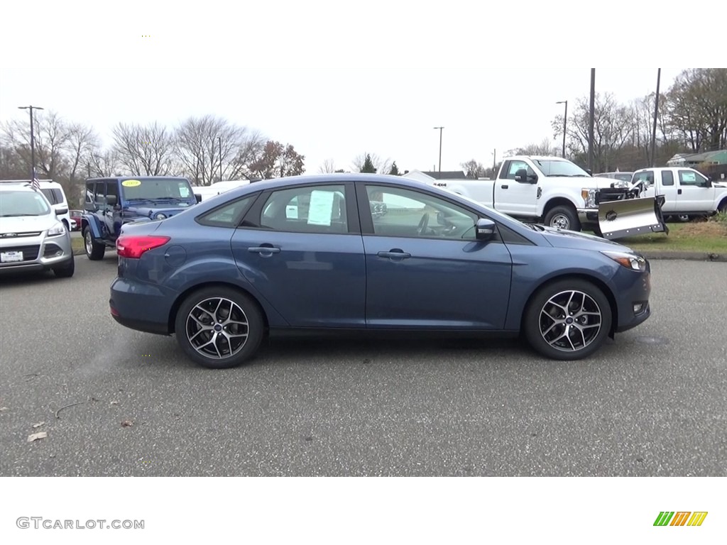 Blue Metallic 2018 Ford Focus SEL Sedan Exterior Photo #123979051