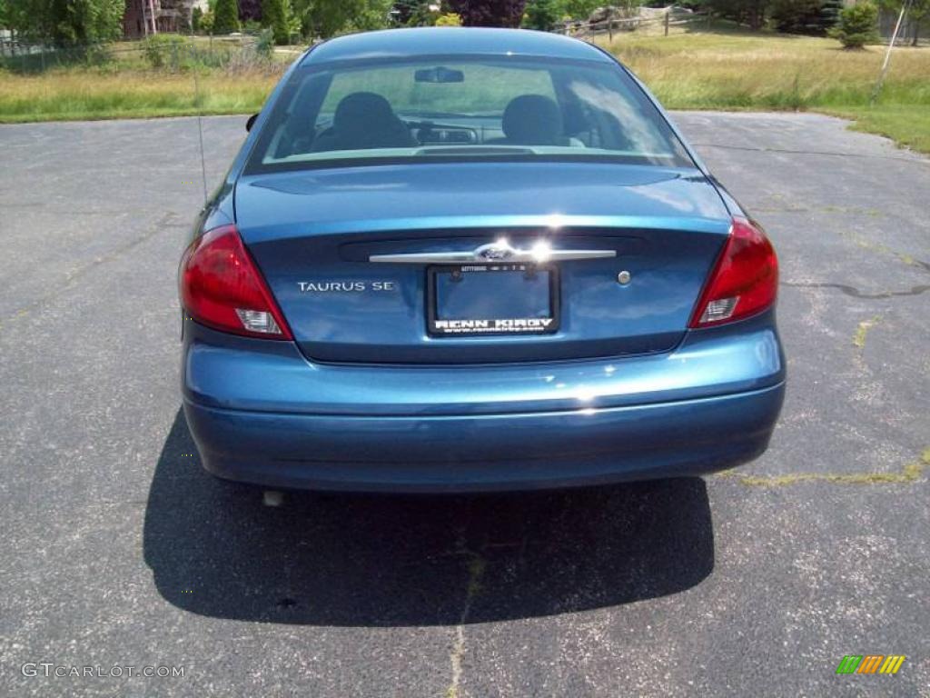 2002 Taurus SE - Medium Royal Blue Metallic / Medium Parchment photo #7