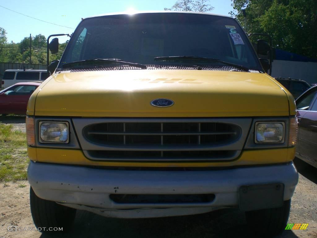 Yellow Ford E Series Van